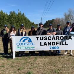 tuscarora landfill sign with students